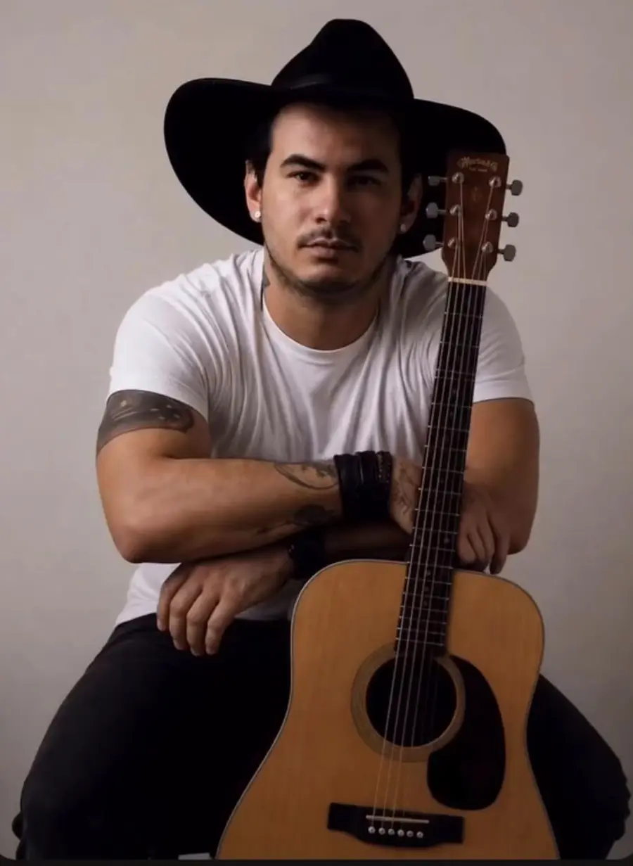 Alan playing acoustic guitar